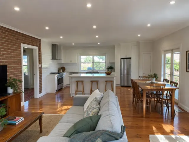 Kitchen and living room with recessed LED downlights in a modern home interior in Maitland